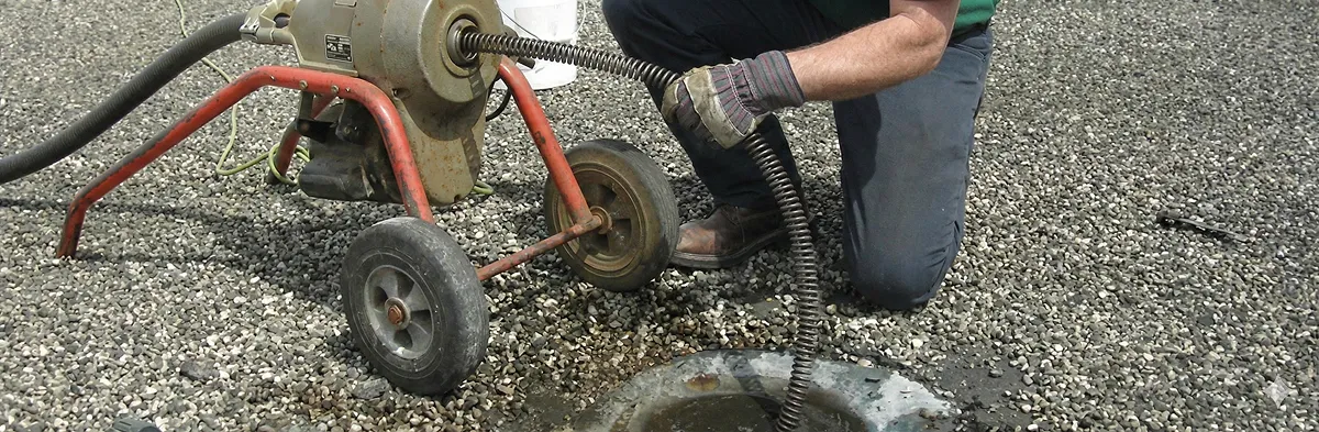 sewer rodding technician actively removing blockages from a sewer line in Reno, NV